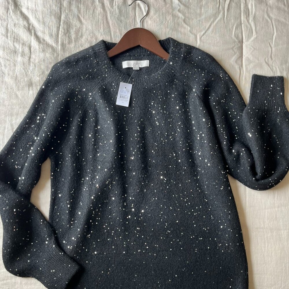 Black sweater with small, shiny metallic specks